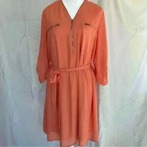 YA Los Angeles coral dress with belt and gold zipper detail.